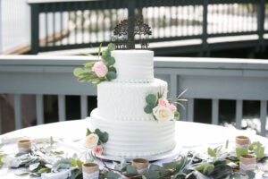Three Tier Texture Wedding Cake with White and Pink Roses and Greenery