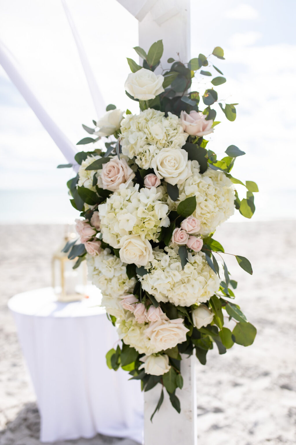 White and Blush Rose Wedding Florals with Greenery in Beachfront Wedding Decor | South Florida Wedding Beach Ceremony the Resort at Longboat Key Club