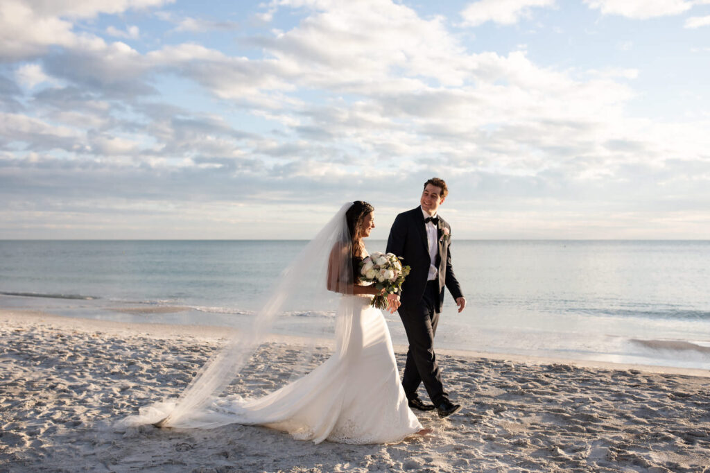Bride and Groom Walking Down the Beach Wedding Portrait | The Resort at Longboat Key Club