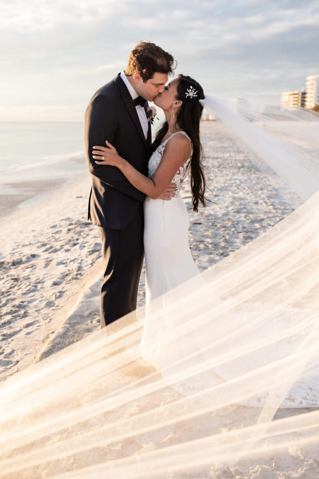 Bride and Groom Kissing Beach Wedding Portrait | The Resort at Longboat Key Club