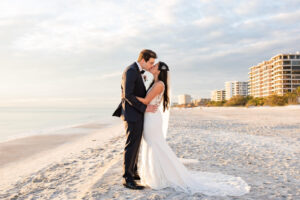 Bride and Groom Kissing Beach Wedding Portrait | The Resort at Longboat Key Club