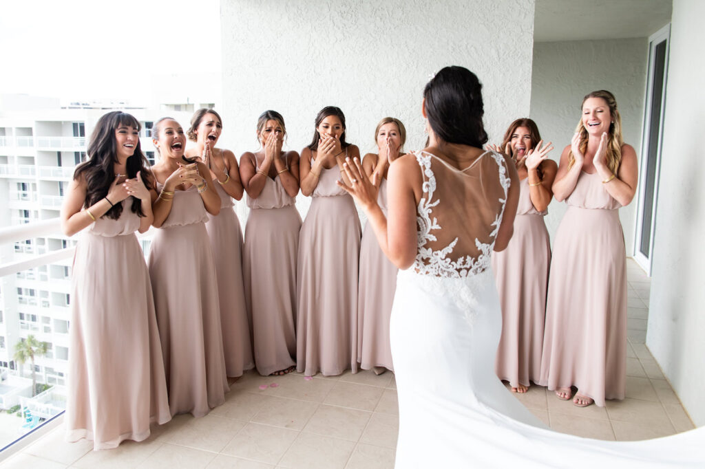 Bride First Look with Bridesmaids Portrait | Bridesmaids in Blush Long Bridesmaids Gowns | Birdy Grey