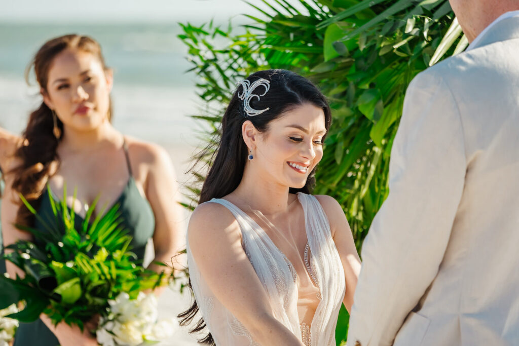 Elegant Florida Bride Exchanging Vows during BeachFront Wedding Ceremony