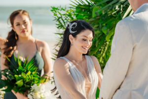Elegant Florida Bride Exchanging Vows during BeachFront Wedding Ceremony