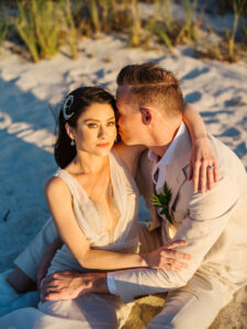 Elegant Florida Bride and Groom Kissing on Beachfront Portrait