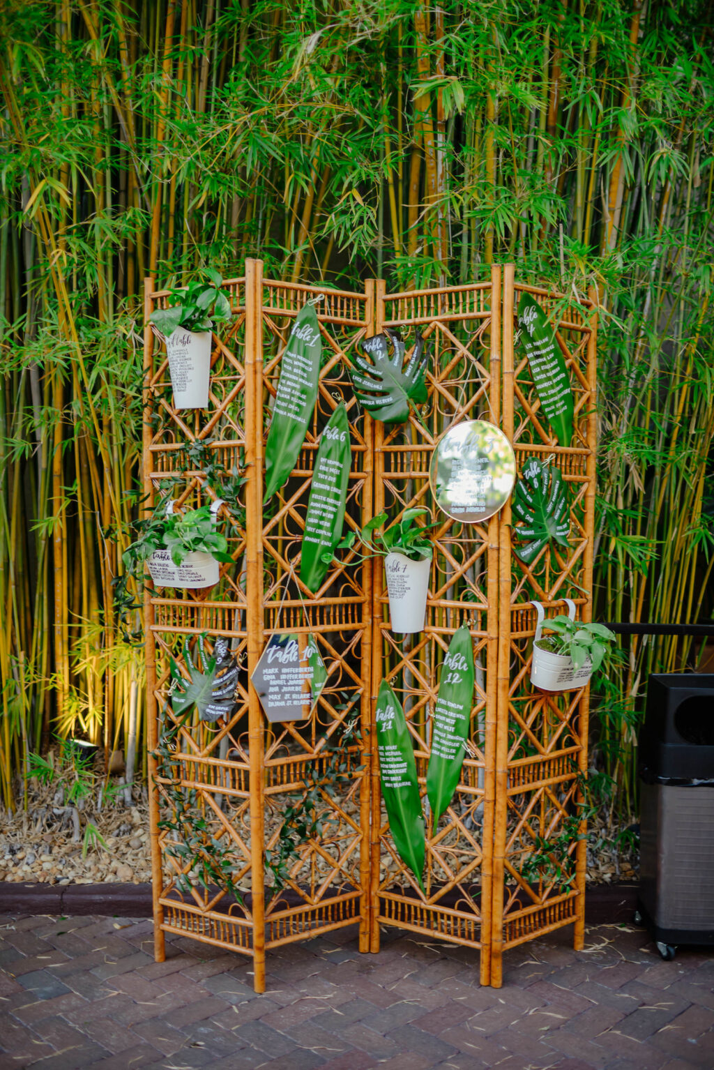 Tropical Inspired Florida Wedding Reception and Decor, Bamboo Seating Chart with Calligraphy on Plant Leafs| Unique Florida Wedding Venue NOVA 535 in Downtown St. Pete