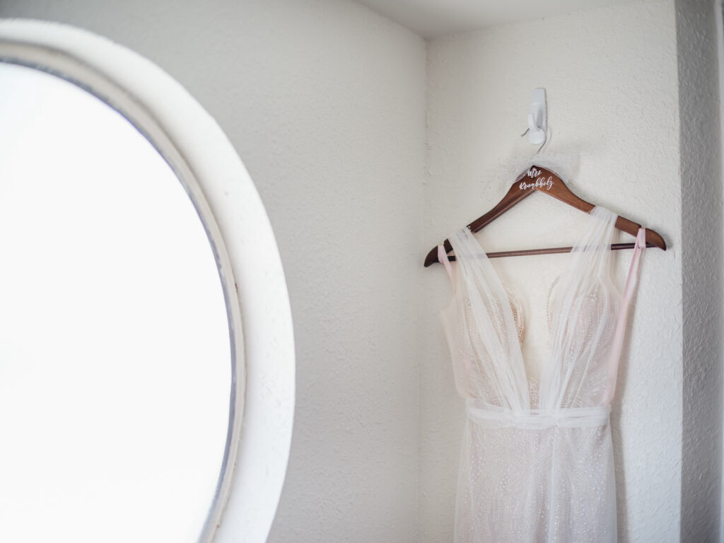 Hanging Florida Beach Wedding Dress on Customized Wooden Hanger | Ines Di Santo