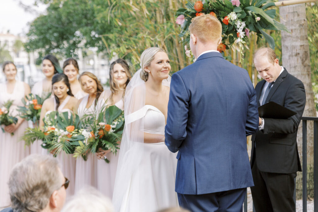 Tampa Tropical Pink and Green Wedding | Bride and Groom Exchanging Wedding Ceremony Vows | Tampa Bay Wedding Planner Coastal Coordinating | Wedding Hair and Makeup Savannah Olivia Beauty