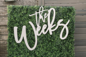 Tropical Pink and Green Wedding Reception Decor, Greenery Hedge Wall Backdrop with Laser Cut Couple Name | Tampa Bay Wedding Planner Coastal Coordinating