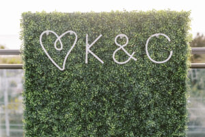 Tropical Pink and Green Wedding Reception Decor, Greenery Hedge Wall Backdrop with Neon Custom Letters | Tampa Bay Wedding Planner Coastal Coordinating