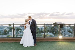 Romantic Bride and Groom Sunset Kissing Rooftop Waterfront Portrait | St. Pete Wedding Venue Hotel Zamora