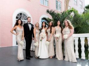 Florida with Bridal Party, Bridesmaids in Elegant Matching Gold Sequin Dresses and Groomsman in Black Tuxedo | St. Petersburg Wedding Venue Pink Palace The Don CeSar Hotel