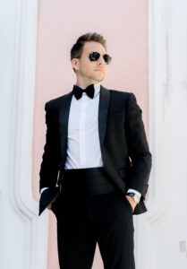 Classic Tampa Groom Wearing Black Tuxedo with Bowtie and Sunglasses