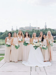 White and Green Modern Minimalist Tropical Wedding Bridal Party, Bridesmaids in Mix and Match Champagne Dresses Holding White Flowers and Palm Leaf Floral Bouquets | Tampa Bay Wedding Hair and Makeup Femme Akoi Beauty Studio | The University of Tampa