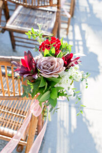 Dusty Rose and Mauve Wedding Ceremony Decor, Wooden Bamboo Chairs, Mauve and Red Roses, White Flowers, Greenery Floral Arrangement | Tampa Bay Wedding Photographer Carrie Wildes Photography | Wedding Florist Iza’s Flowers | St. Pete Wedding Planner Perfecting the Plan | Wedding Chair Rentals A Chair Affair