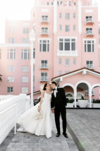 Florida Classic Timeless Bride and Groom Outside Historic St. Pete Wedding Venue Pink Palace The Don CeSar Hotel