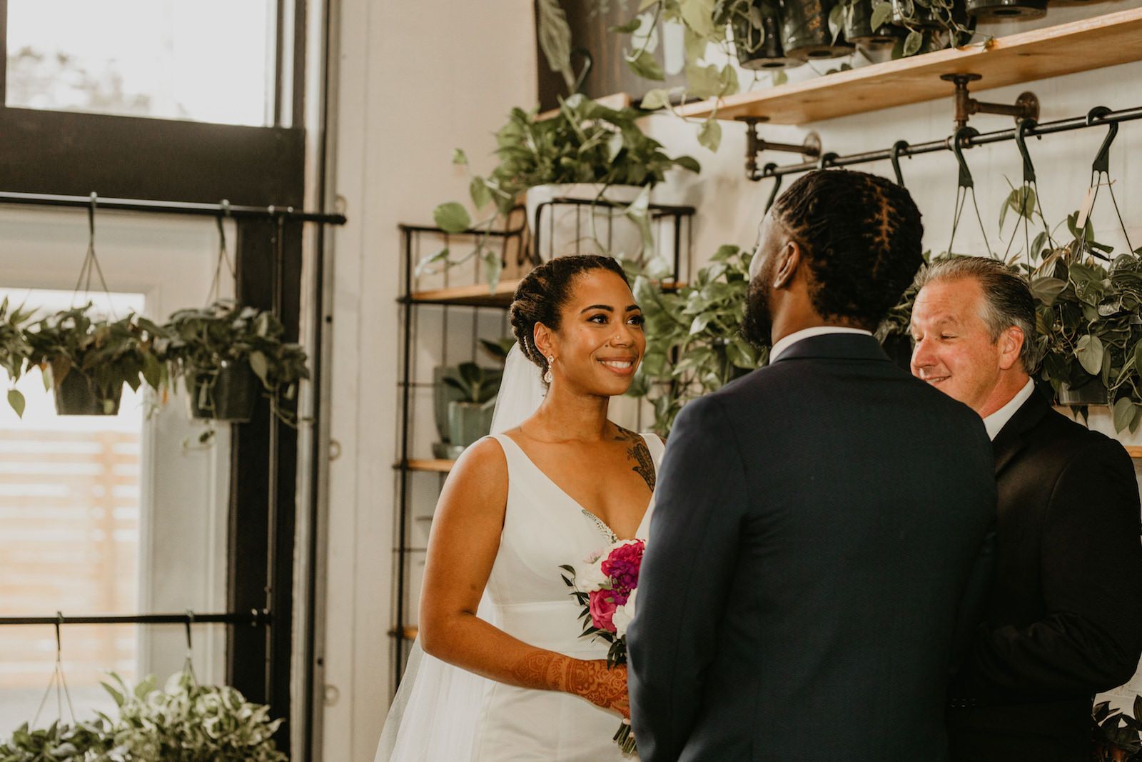 Intimate Elopement Wedding Ceremony, Bride and Groom Exchanging Wedding Vows at Unique Plant Shop Wedding Venue Wild Roots | Tampa Bay Wedding Planner Elope Tampa Bay