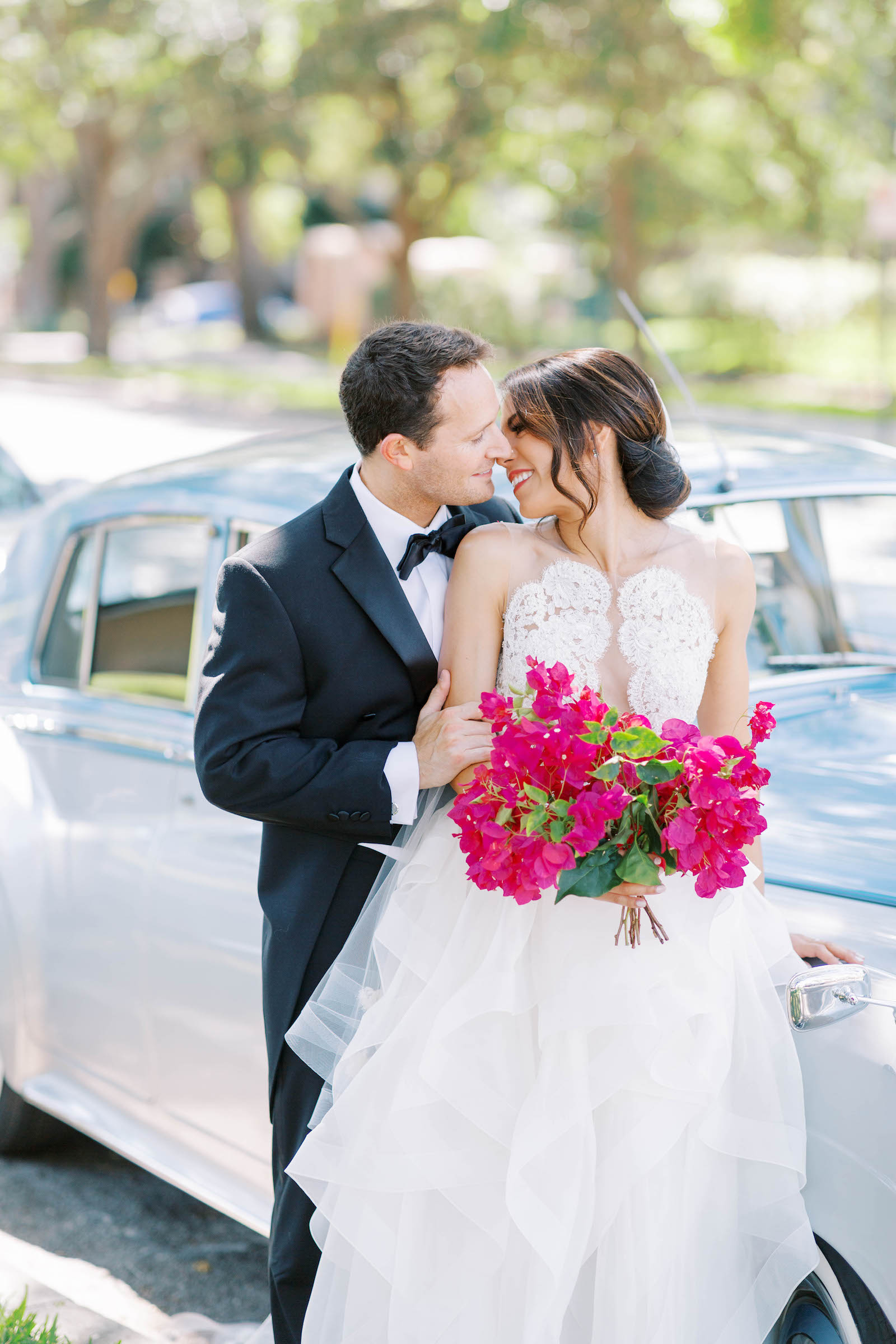 Bride and Groom Wedding Portrait with Vintage Car and Fuchsia Pink Bouquet