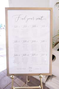 Wedding Seating Chart in Gold Frame and Cursive Lettering
