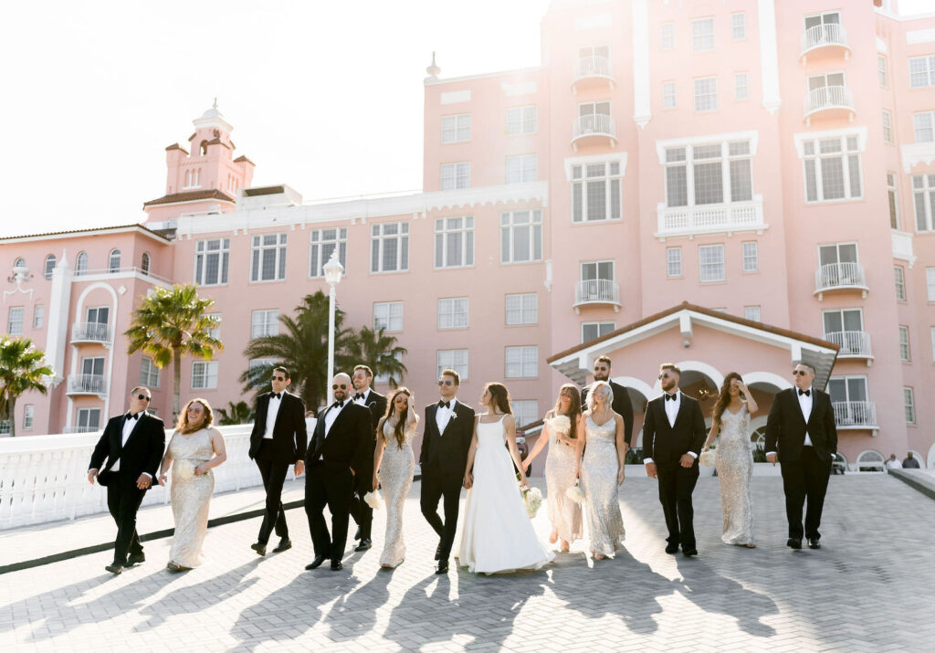 Florida Classic Timeless Bride and Groom with Bridesmaids and Groomsmen Wedding Party Photo Outside Historic St. Pete Wedding Venue Pink Palace The Don CeSar Hotel