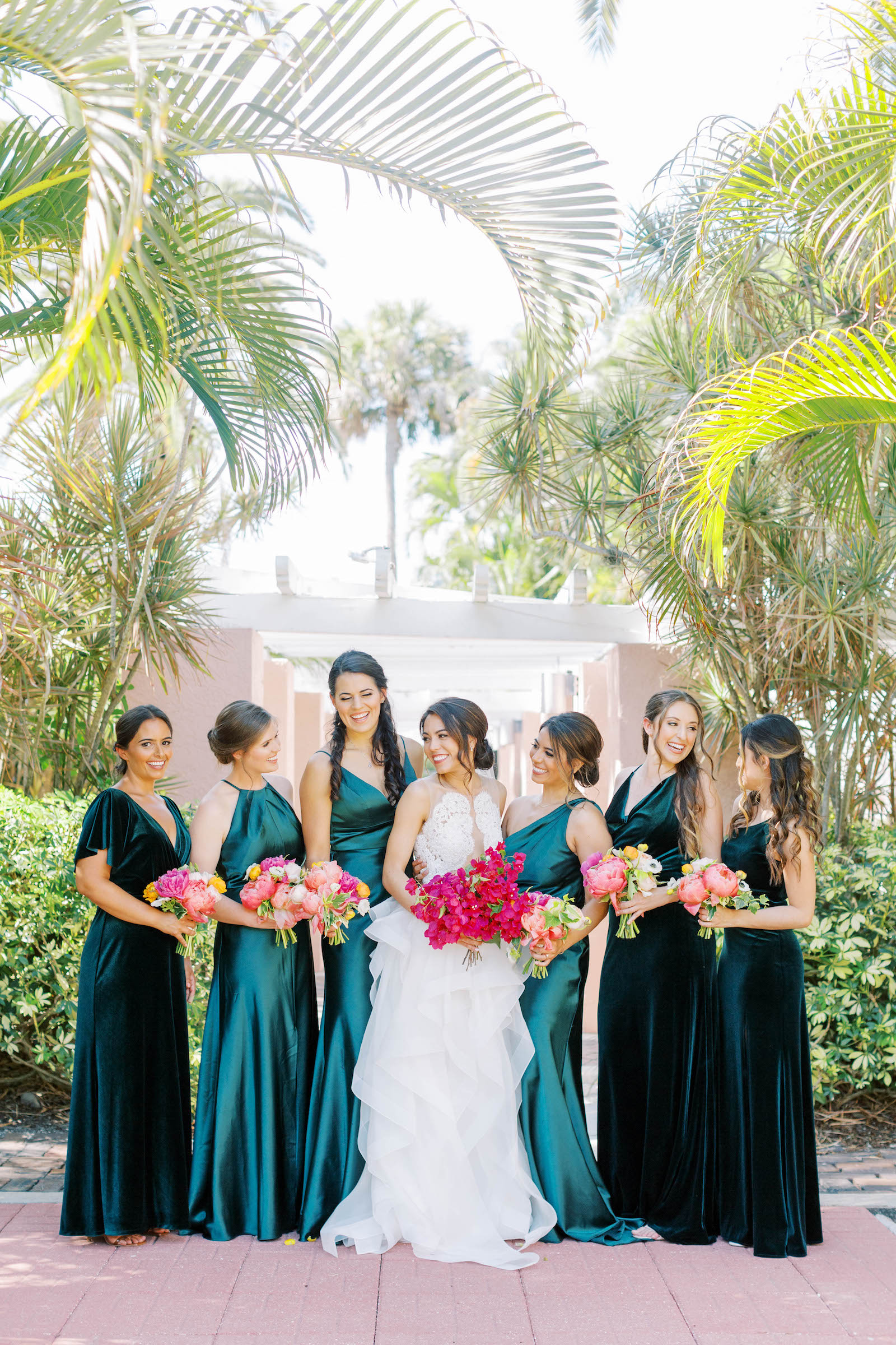 Bride with Bridesmaids in Emerald Green Mix and Match Floor Length Satin and Velvet Dresses with Hot Pink Flower Bouquets