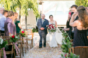 Dusty Rose and Mauve Wedding Ceremony, Bride Holding Lush Mauve, Red and White Roses with Greenery Floral Bouquet Walking with Father Down Wedding Aisle | Tampa Bay Wedding Photographer Carrie Wildes Photography | Wedding Florist Iza’s Flowers | Wedding Planner Perfecting the Plan