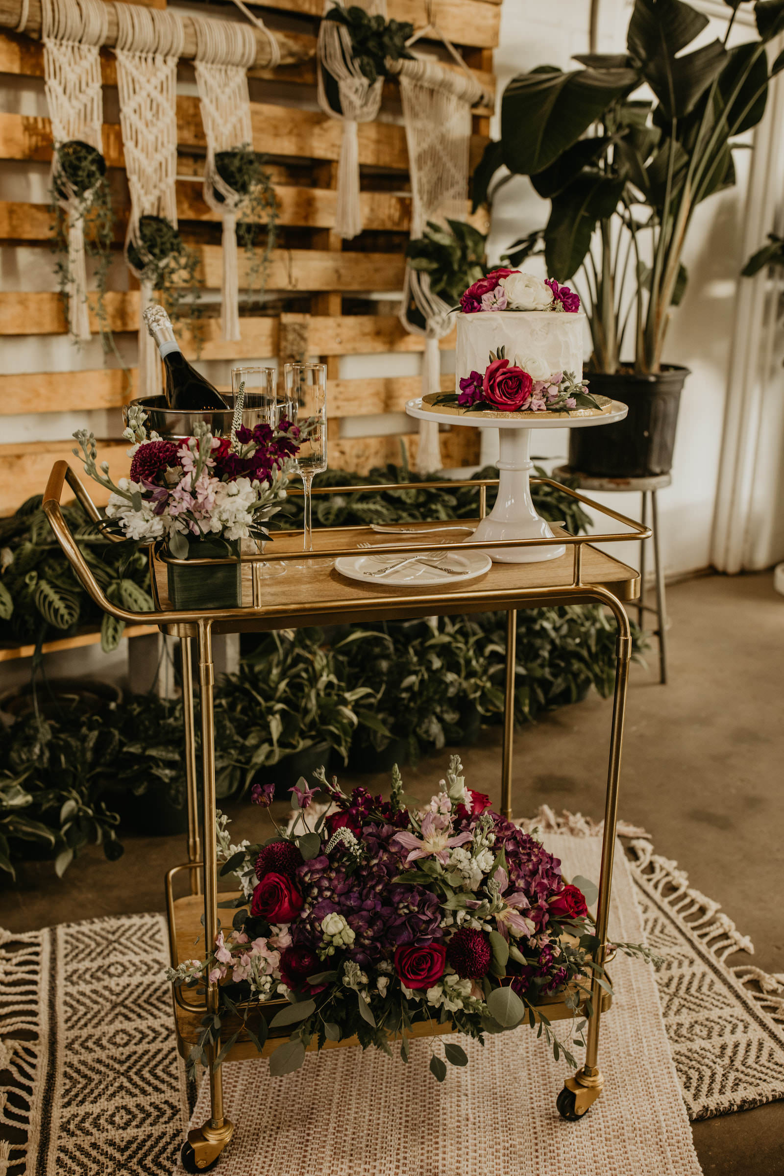 Intimate Elopement Wedding, Vintage Gold Bar Cart with Boho Purple, Red and Pink Florals and Eucalyptus Greenery Bouquet, One Tier White Wedding Cake with Flowers | Tampa Bay Wedding Planner Elope Tampa Bay | Unique Plant Shop Wedding Venue Wild Roots