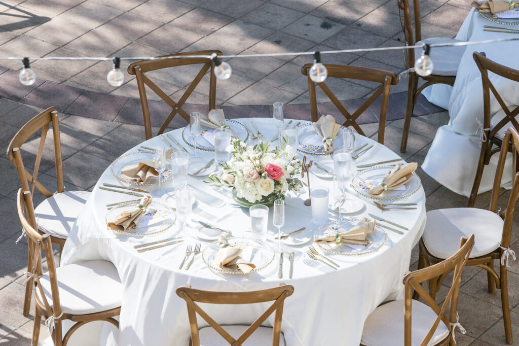 Outdoor Wedding Reception with Round Tables with White Linen and Rustic Cross back Wooden Chairs | Westshore Yacht Club