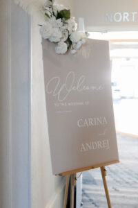 Classic Timeless Wedding Reception Decor, Taupe Welcome Sign with White Floral Arrangement | Tampa Bay Wedding Planner Elegant Affairs by Design
