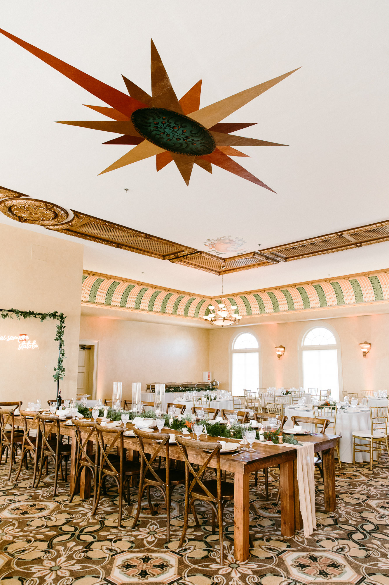 Rustic Italian Elegant Wedding Reception Decor, Ivory Cheesecloth Table Runner, Greenery, Candles, Neon Sign, Rectangular Arch with Greenery, Long Wooden Feasting Table | Tampa Bay Wedding Rentals Outside the Box Rentals | Venue The Italian Club
