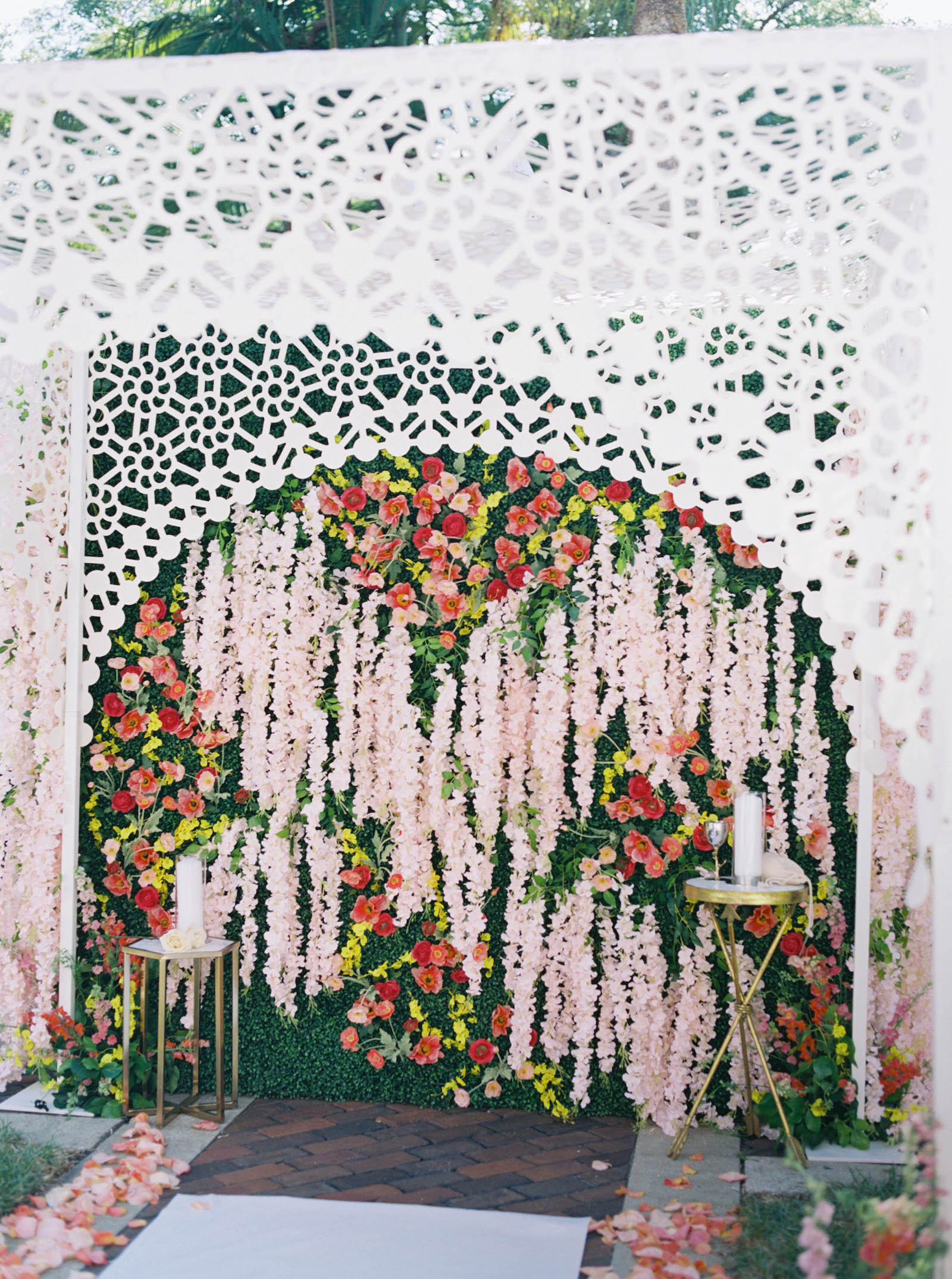 Luxurious Floral Ceremony Arch and Jewish Chuppah with Orange and Pink Draping Florals and Greenery | St. Pete Wedding Ceremony Venue Vinoy Renaissance | Planner Parties a la Carte