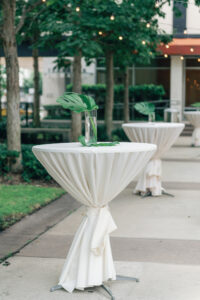White and Green Modern Minimalist Tropical Wedding Cocktail Hour Decor, Tall Tables with Simple Monstera Palm Leaf Centerpiece | Tampa Bay Wedding Planner Taylored Affairs