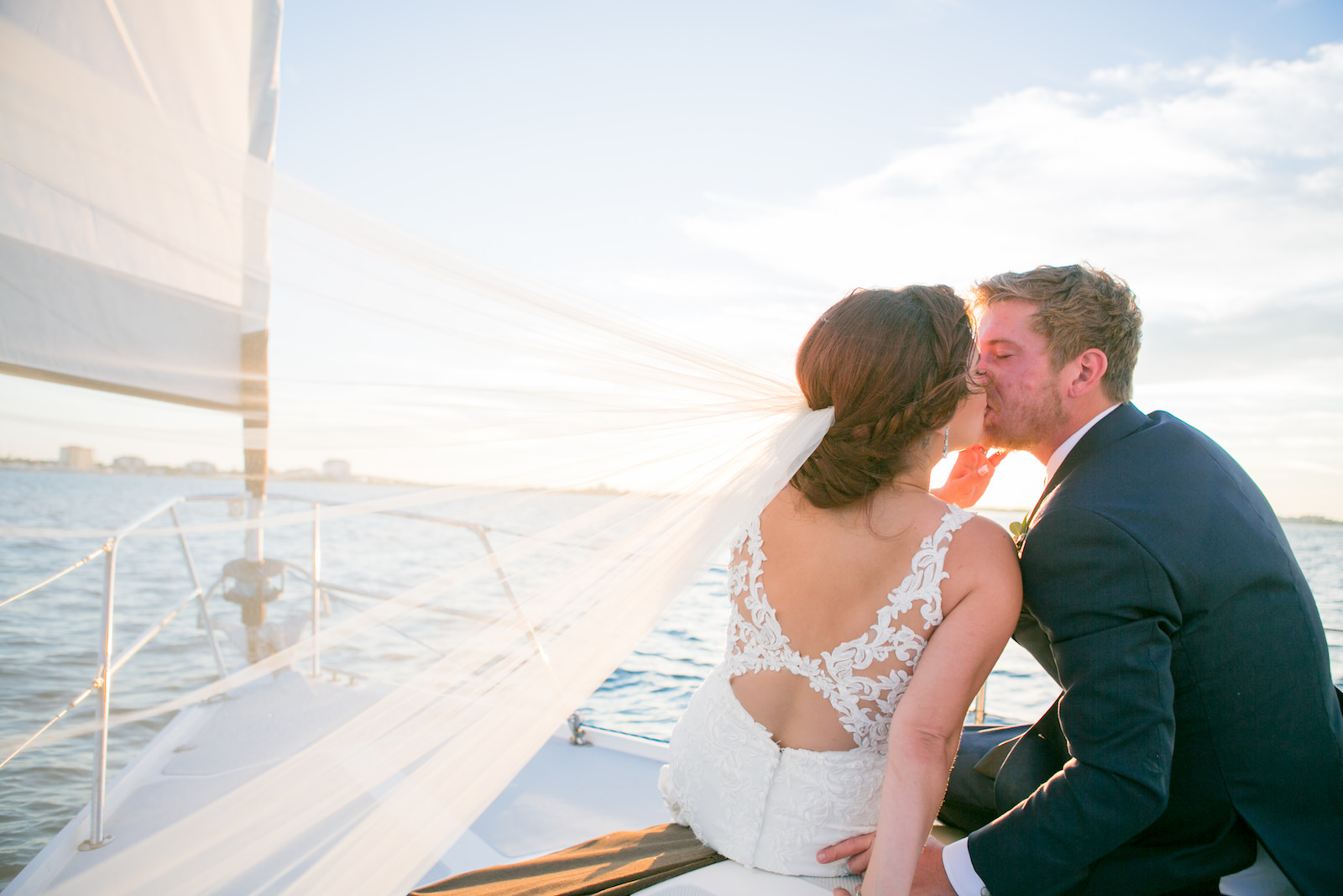 Florida Bride and Groom Sitting on Sail Boat Wedding Portrait | Tampa Bay Wedding Photographer Carrie Wildes Photography