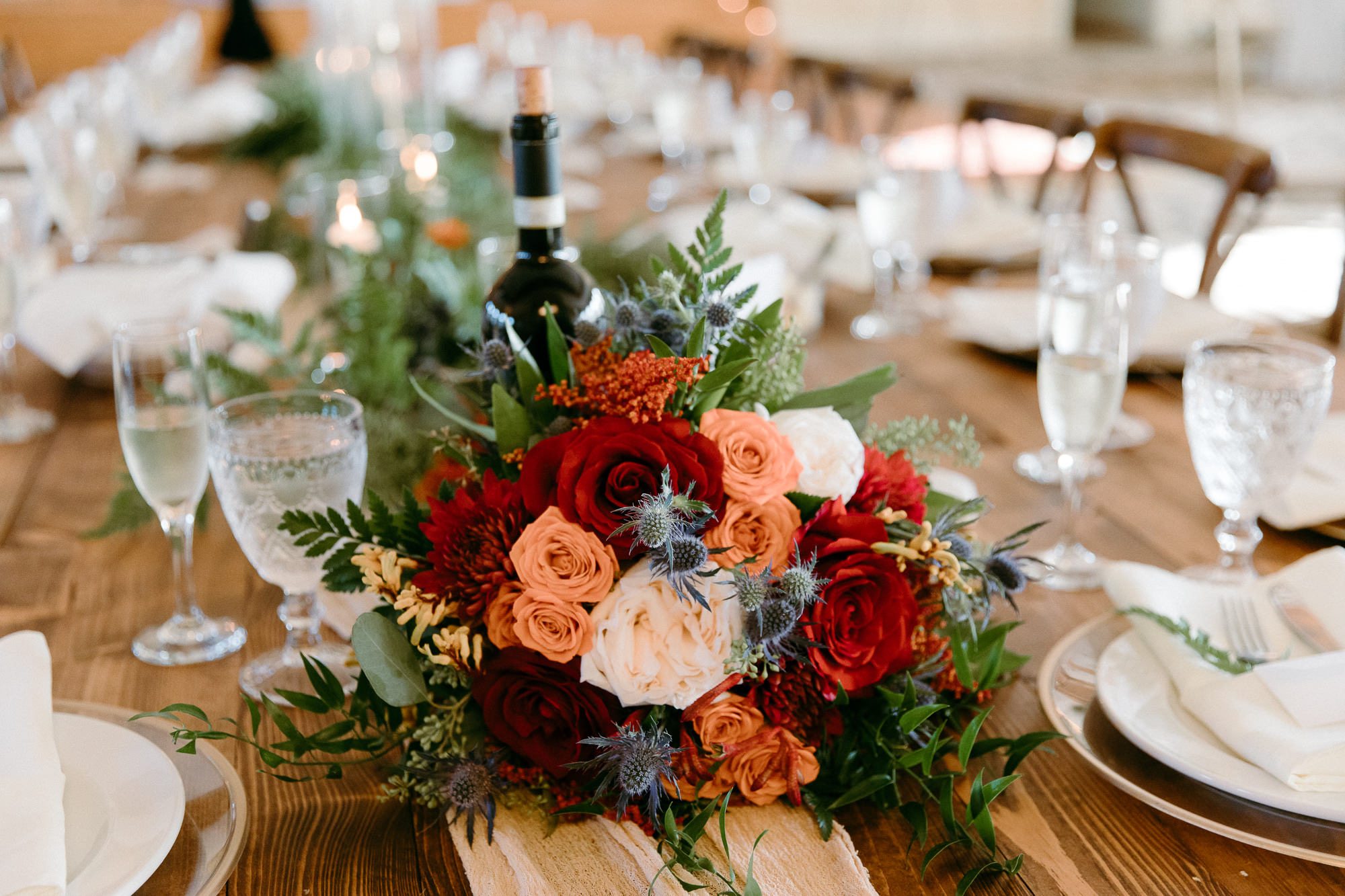Rustic Italian Elegant Wedding Reception Decor, Lush Red, Terracotta, White Roses, Thistle, and Greenery Floral Bouquet | Tampa Bay Wedding Rentals Outside the Box Rentals