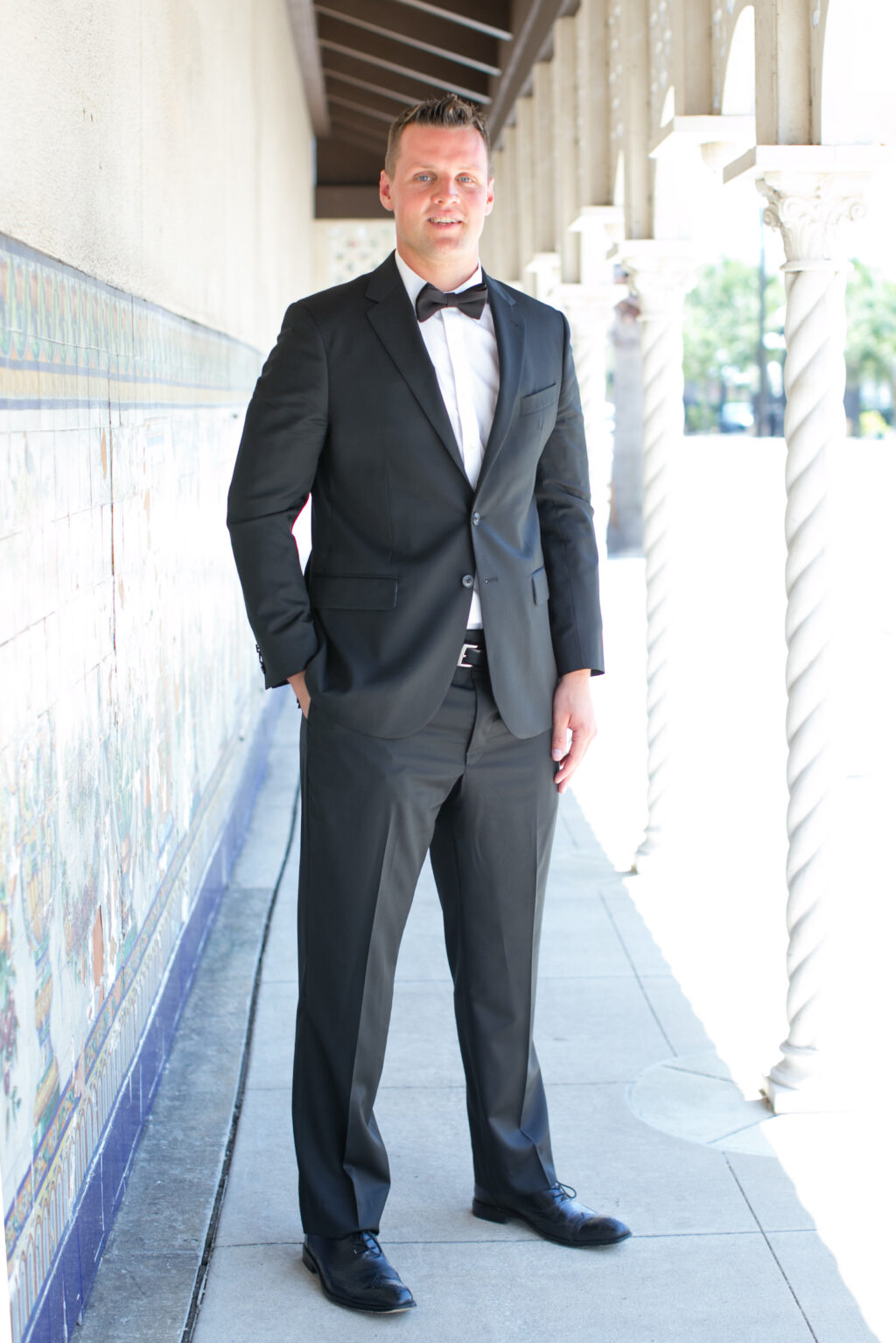 Groom in Black Tux with Black Bow Tie Portrait | Carrie Wildes Photography