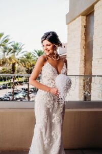 Bride Wearing Lace and Illusion Fitted Wedding Dress Holding White Baby's Breath Floral Bouquet | Tampa Bay Wedding Hair and Makeup Adore Bridal