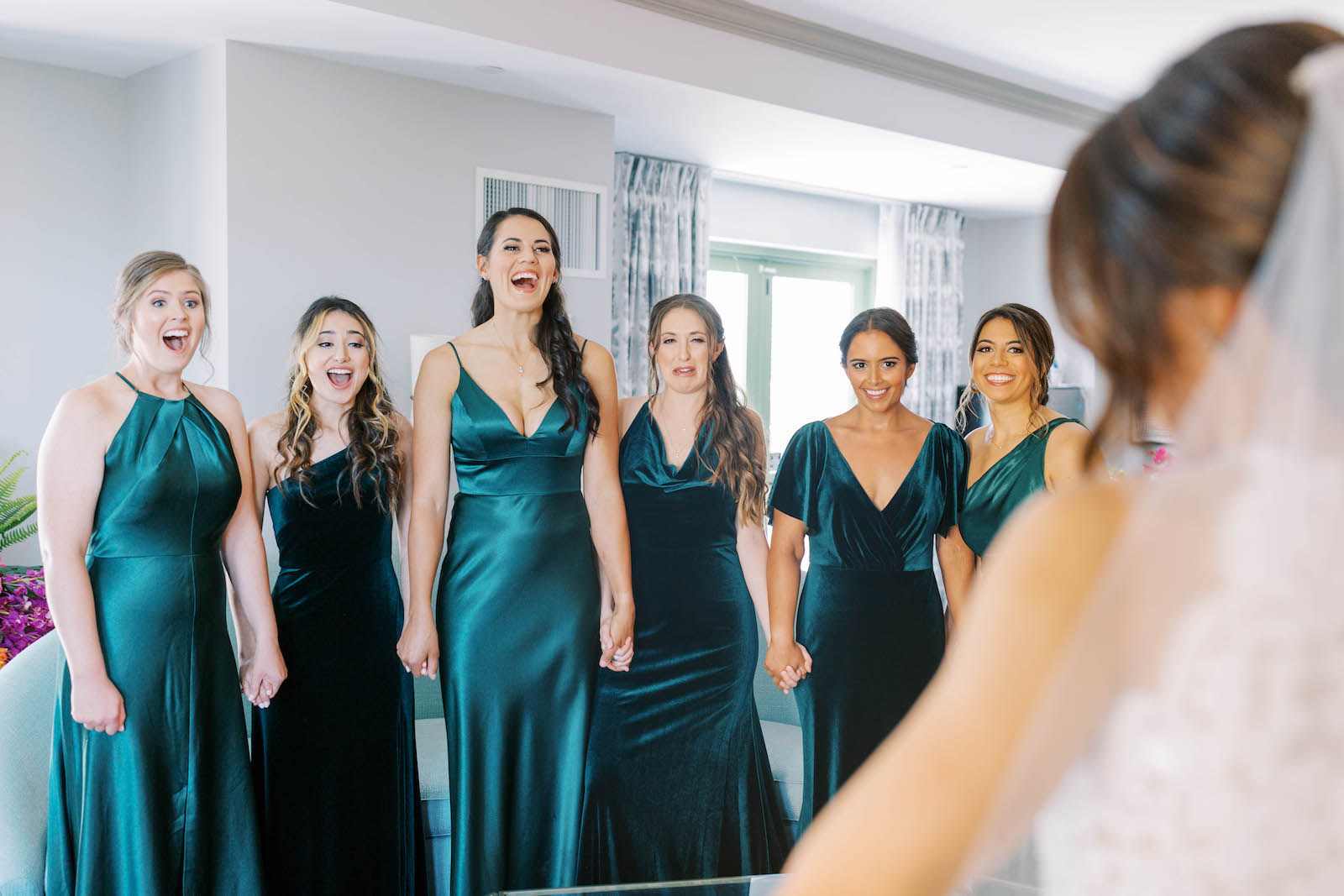 Bride and Bridesmaids First Look Wedding Portrait | Bridesmaids in Emerald Green Mix and Match Satin Floor Length Dresses