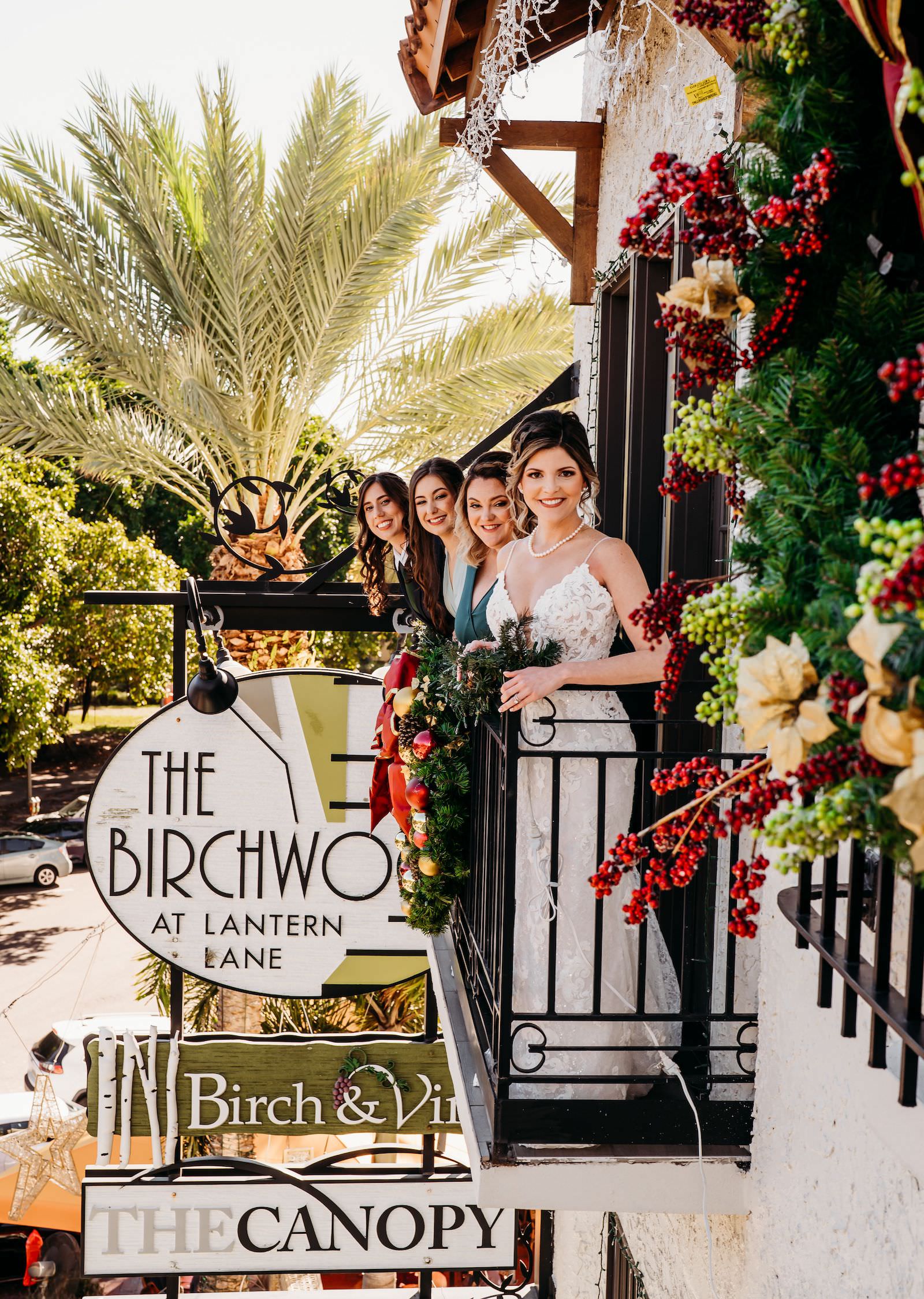 Bride and Bridesmaids on Balcony of St. Pete Wedding Venue The Birchwood | Tampa Bay Wedding Hair and Makeup Adore Bridal
