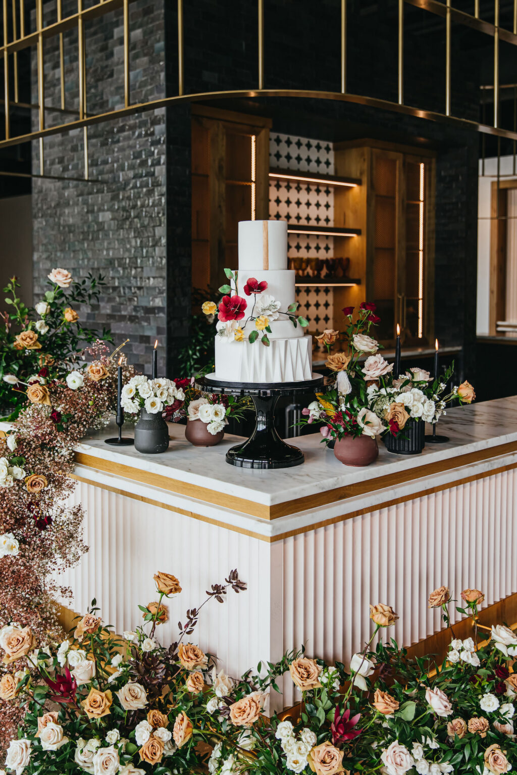 Modern and Edgy Fall Wedding Reception Decor, Three Tier White Textured Wedding Cake with Real Red and Yellow Flowers, White and Gold Bar Decorated with Lush Floral Arrangements, Greenery, Yellow, Blush Pink and Burgundy Read Roses, Babys Breathe | South Tampa Wedding Venue Hyde House