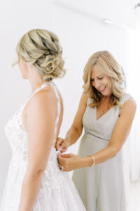 Mother of the Bride Helping Bride Getting Ready Morning of Her Wedding Day Portrait