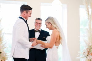Modern and Timeless Black and White Wedding Ceremony, Bride and Groom Exchanging Wedding Vows, White and Blush Pink Roses with Pampas Grass Floral Arrangement | Tampa Bay Wedding Photographer Lifelong Photography Studio | Wedding Venue Oxford Exchange