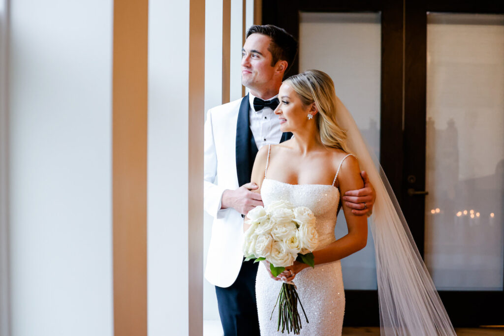 Modern and Timeless Black and White Wedding, Bride Wearing Full Length Veil and Sequin Wedding Dress Holding White Roses Bouquet, Groom Wearing Black and White Tuxedo | Tampa Bay Wedding Photographer Lifelong Photography Studio
