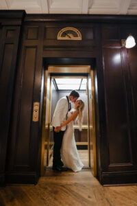 Modern and Timeless Black and White Wedding, Bride and Groom Kissing in Elevator | Tampa Bay Wedding Photographer Lifelong Photography Studio | Wedding Venue Oxford Exchange