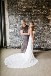 Modern and Timeless Wedding, Bride Putting on Fitted Sequin Wedding Dress with Mom | Tampa Bay Wedding Photographer Lifelong Photography Studio | Wedding Venue The Oxford Exchange