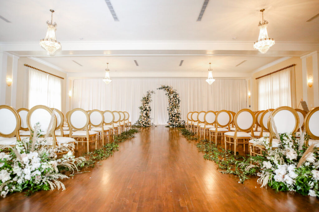 Romantic Indoor Garden Wedding Ceremony with Draped Backdrop, Curved Arch, King Louis Chairs and White and Greenery Florals | South Tampa Venue The Orlo | Kate Ryan Event Rentals | Photographer Lifelong Photography Studio