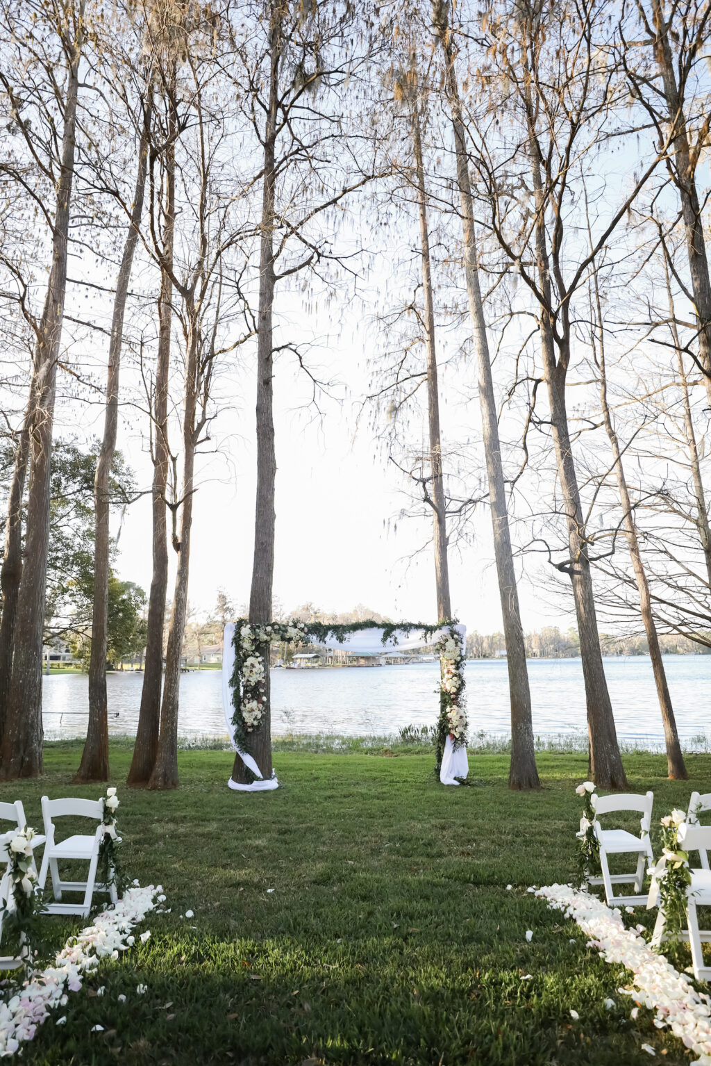 Romantic Outdoor Wedding Ceremony Decor, Wooden Arch with White Linen Draping and Floral Arrangements | Tampa Bay Wedding Photographer Lifelong Photography Studio | Wedding Planner Special Moments Event Planning