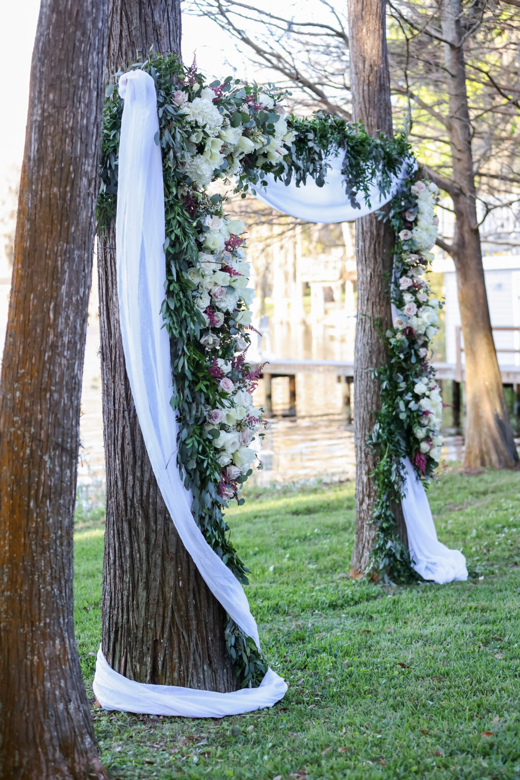 Romantic Outdoor Wedding Ceremony Decor, Wooden Rectangular Arch Attached to Tree with White Linen Draping, Greenery and White Floral Arrangement | Tampa Bay Wedding Photographer Lifelong Photography Studio | Wedding Planner Special Moments Event Planning