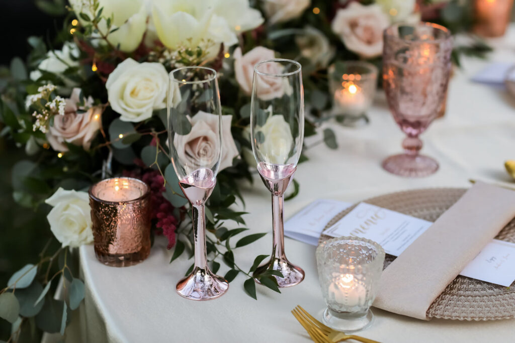 Romantic Pink and White Wedding Reception Decor, Gold Beaded Charger, Taupe Linen Napkin, Blush Pink Champagne Glasses, Pink Mercury Votive Candles, White Roses, Eucalyptus, Mauve Roses Garland Table Runner | Tampa Bay Wedding Photographer Lifelong Photography Studio | Wedding Planner Special Moments Event Planning | Wedding Rentals Kate Ryan Event Rentals