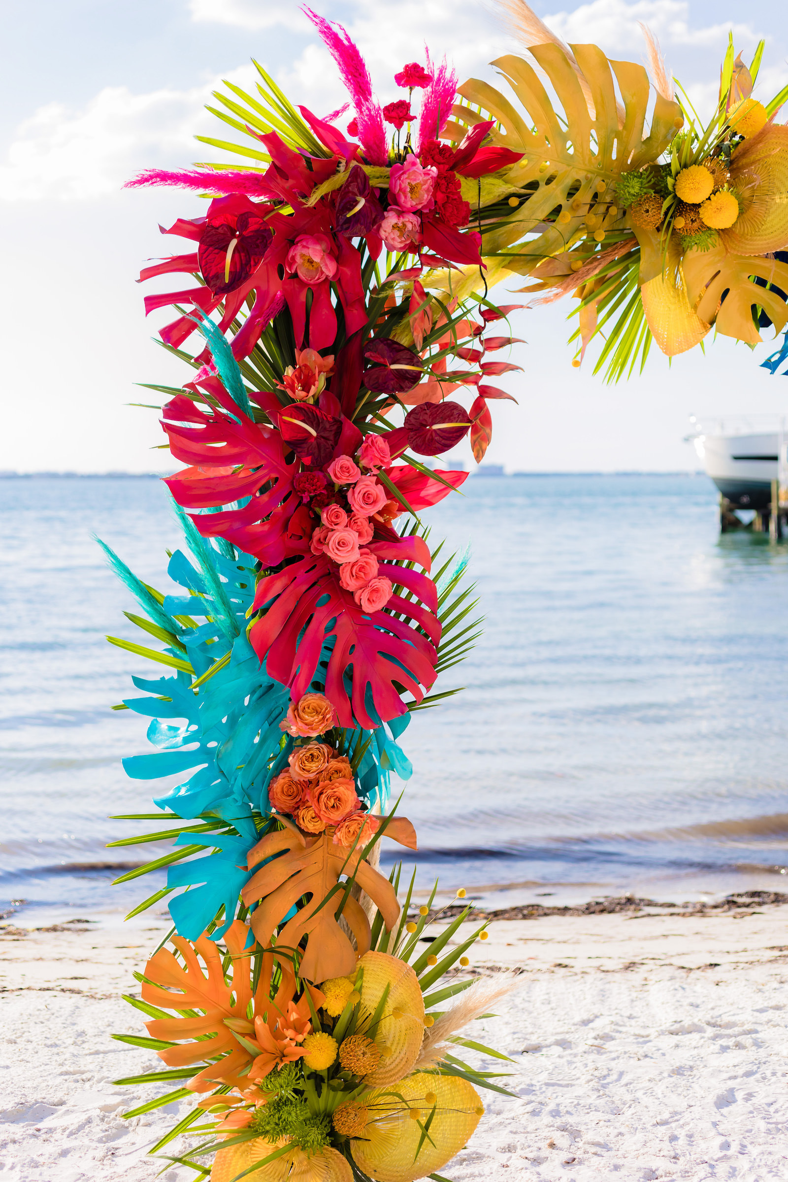 Red, Turquoise, Blue, Orange, and Green Monstera Leaf and Greenery Garland | Wilder Mind Events