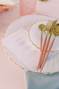 Garden Whimsical Wedding Decor, White and Gold Rimmed Charger, Pink and Gold Silverware | Kate Ryan Event Rentals
